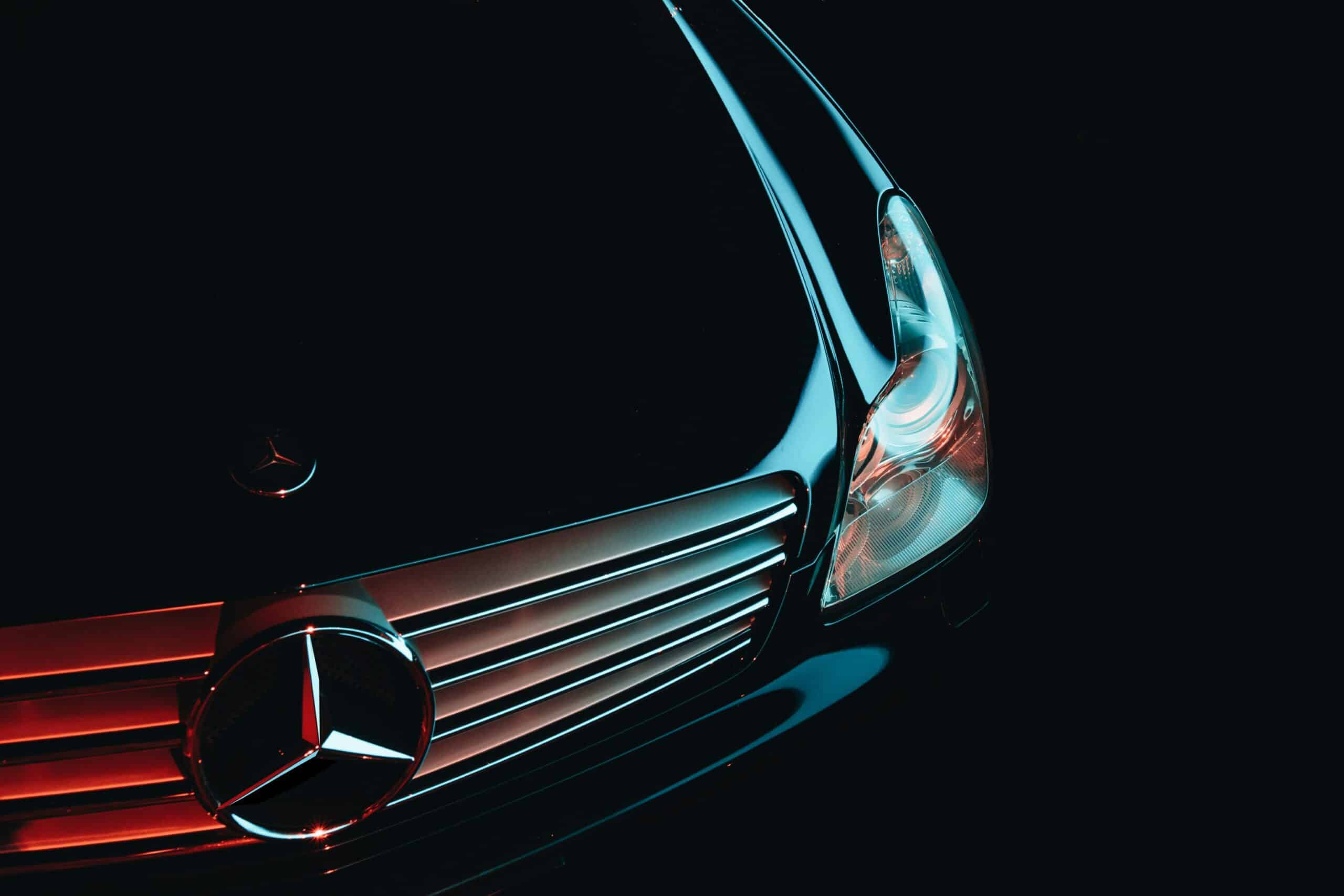 Close-up of the front grille and headlight of a Mercedes-Benz vehicle
